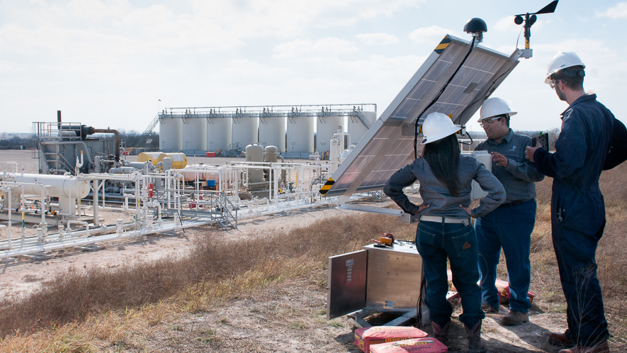 Andrea Carolina and Desikan Sundararajan with Statoil, along with Dirk Richter, founder of Quanta3 (left to right), install a pilot methane detector at a Statoil well pad at the Eagle Ford Shale natural gas site in Texas. Andrea Carolina and Desikan Sundararajan with Statoil, along with Dirk Richter, founder of Quanta3 (left to right), install a pilot methane detector at a Statoil well pad at the Eagle Ford Shale natural gas site in Texas.